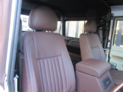 ランドローバー ディフェンダー 110SOFTTOP 2.2Tdci 全席本革シート張替 Marshallスピーカー 新品ウッドステアリング 同色スチールホイール ソフトトップ  稀少10人乗り MT車 Nox/Pm適合 3ナンバー登録 ヘリテイジカスタム  SAFTY DEVICE社製ロールゲージ マッドフラップ スイングリアキャリア 並行輸入車 右ハンドル 記録簿付の中古車