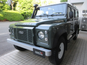 ランドローバー ディフェンダー 110SW 2.2Tdci 稀少サンルーフ Wolfホワイトスチールホイール 5人乗り AT換装済 Nox/Pm適合 3ナンバー ホワイトコントラストルーフ 新品Heritageフロントグリル ヘッドライトサラウンドパネル左右ボディ同色 シュノーケルKIT 前後マッドフラップ サイドランナー 背面タイヤ 並行輸入車 右ハンドル 記録簿付の中古車
